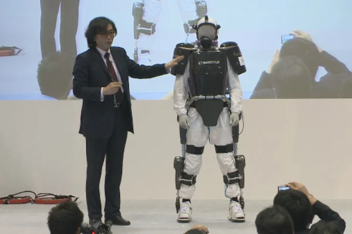 Professor Yoshiyuki Sankai presents the modified HAL exoskeleton during Japan Robot Week 2012