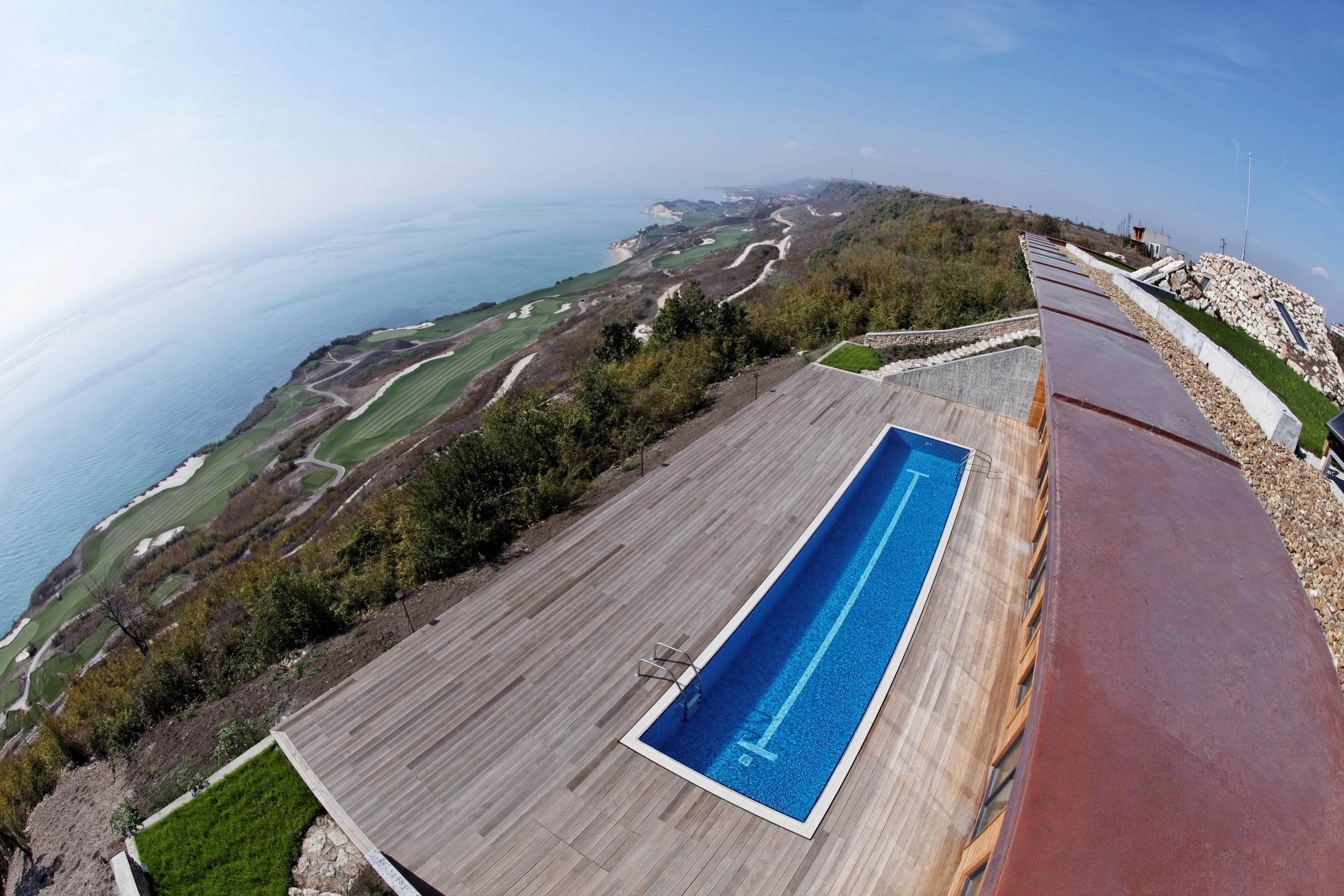 Equinox House's south-facing pool doubles as a reflector, bouncing light into the house (Photo: Ignatov Architects)
