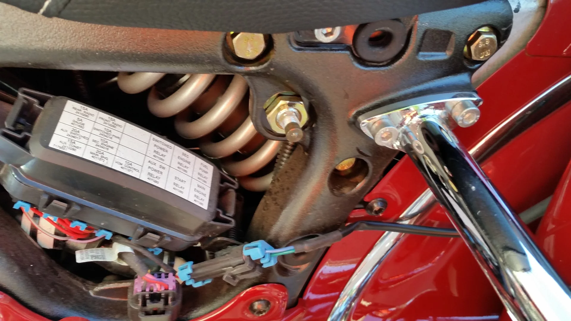 This is the nipple for the air adjustable rear shock; it sits behind the left side plate