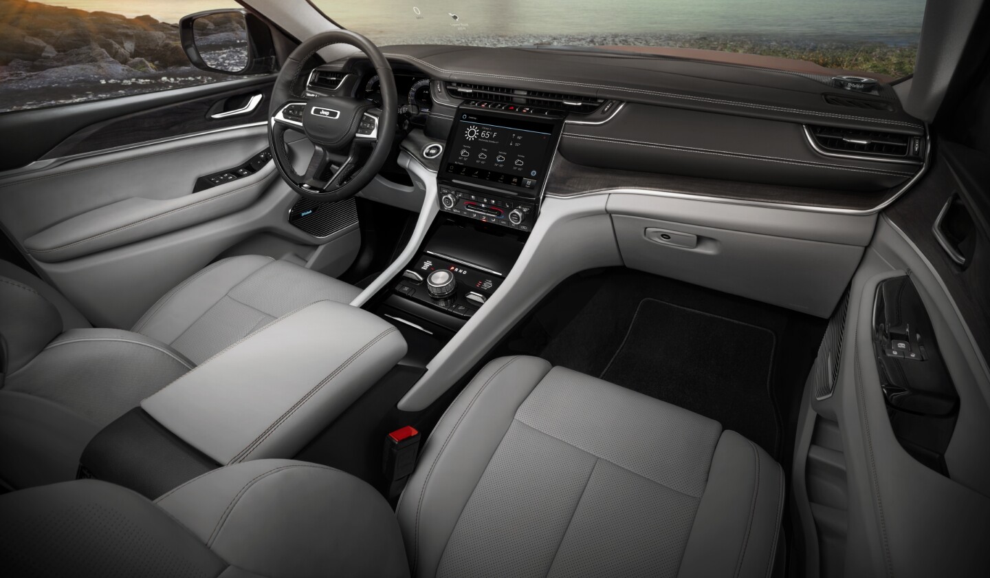 Jeep brings the latest tech to the interior of the Grand Cherokee L, including a frameless digital gauge cluster and pictured 10.1-in Uconnect 5 touchscreen infotainment system