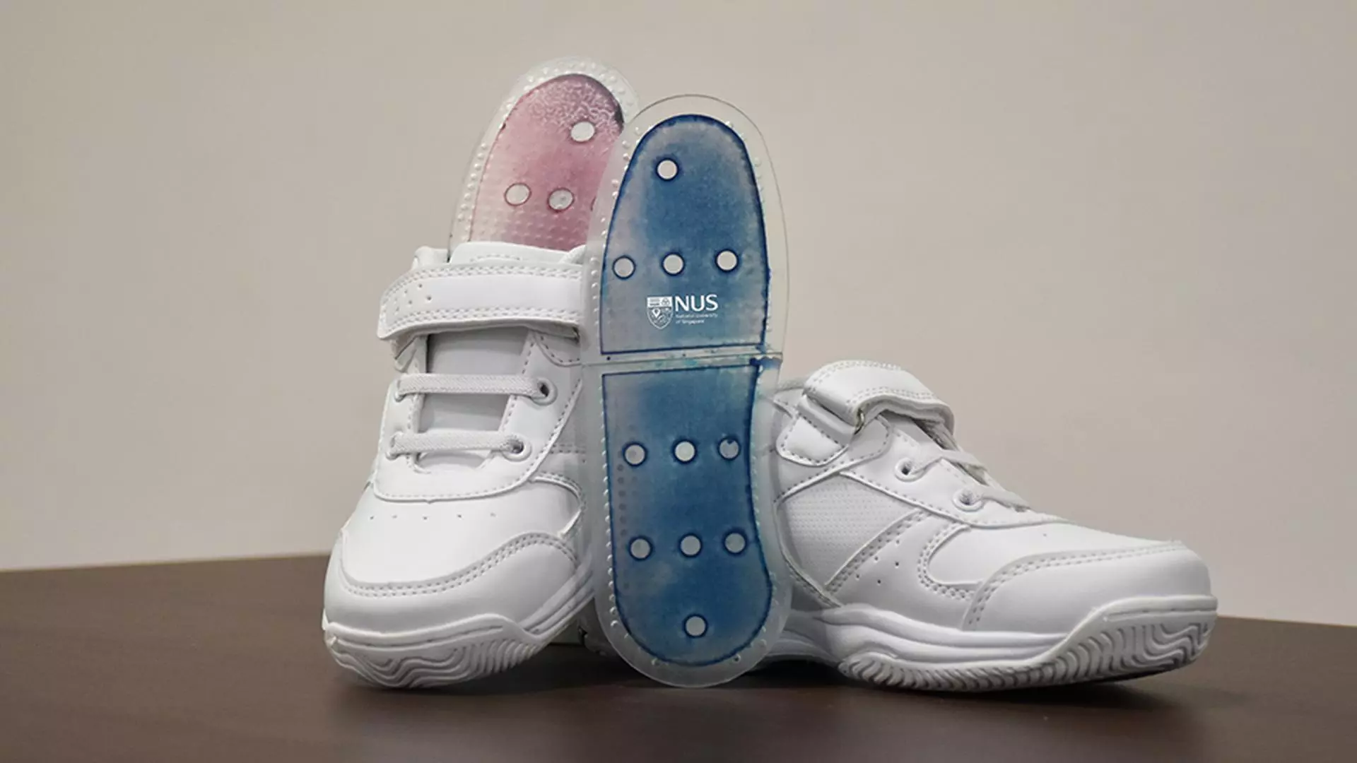 Shoe insoles made with the sweat-absorbing film, which change color from blue to pink as they absorb moisture