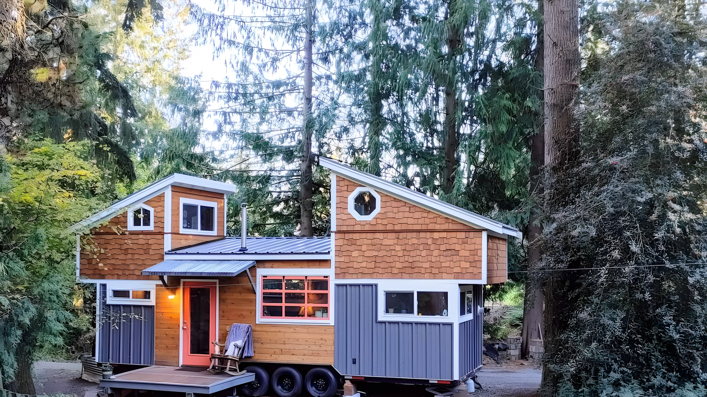 The extraordinary Owl's Nest tiny house features loft bedrooms with folding roofs, allowing it to provide ample headroom and still remain road legal