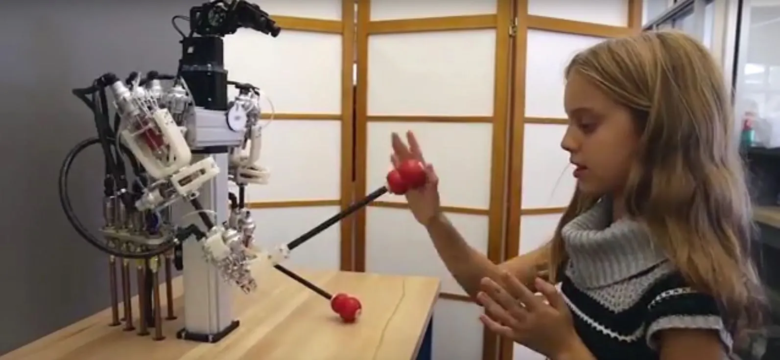 The hybrid robot playing patty cake