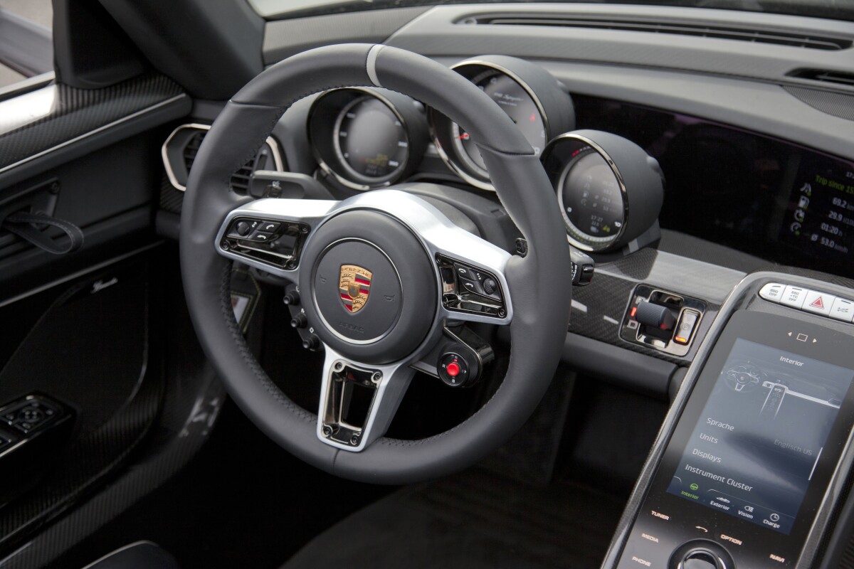 A switch on the steering wheel controls the five driving modes