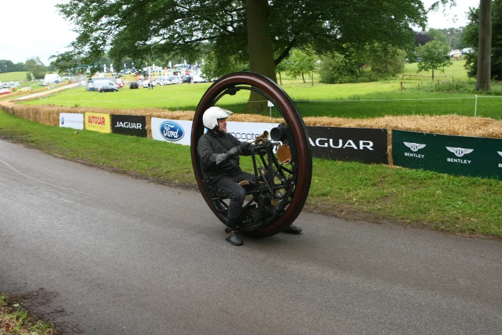 The 1910 Edison-Puton Monowheel has the frame, rider and a 150cc De Dion engine enclosed by the wheel.