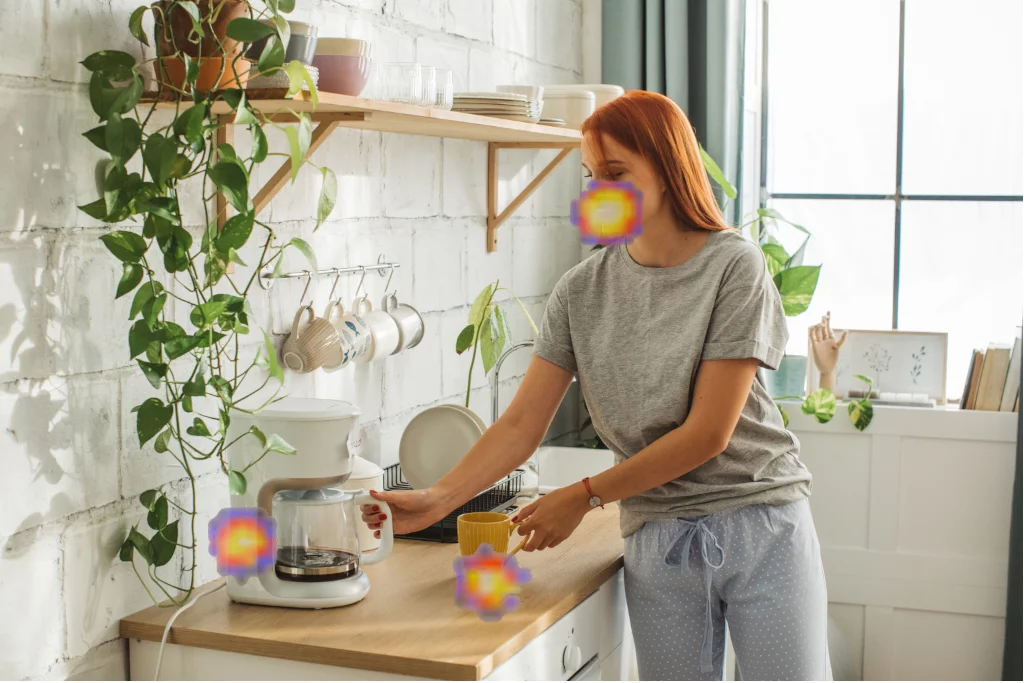 Where are the noises coming from in this picture? According to the SoundCam Go, from the coffeemaker, the mug, and her mouth