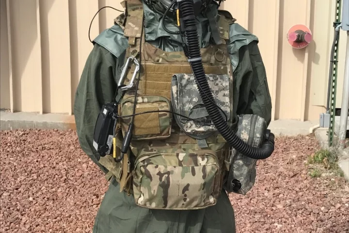 An Airman demonstrates the Joint Service Aircrew Mask - Rotary Wing mask