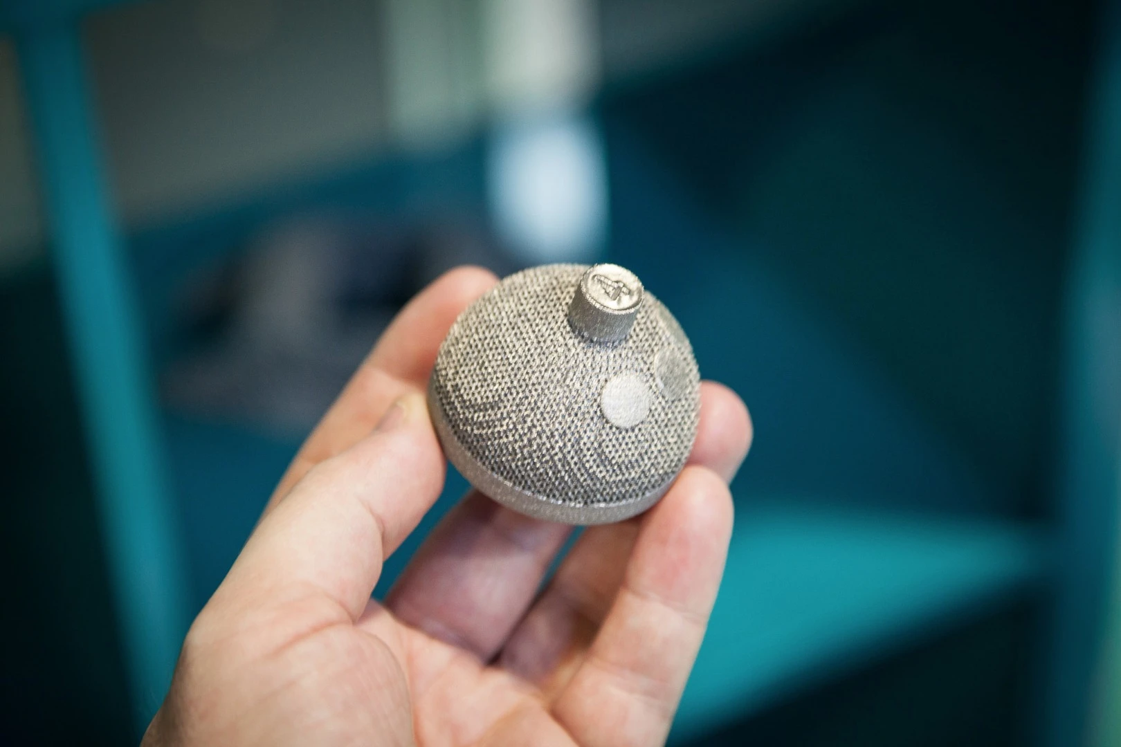 3D-printed acetabular cup to replace part of the human hip joint - rough exterior surface helps the patient's bone to adhere to the titanium