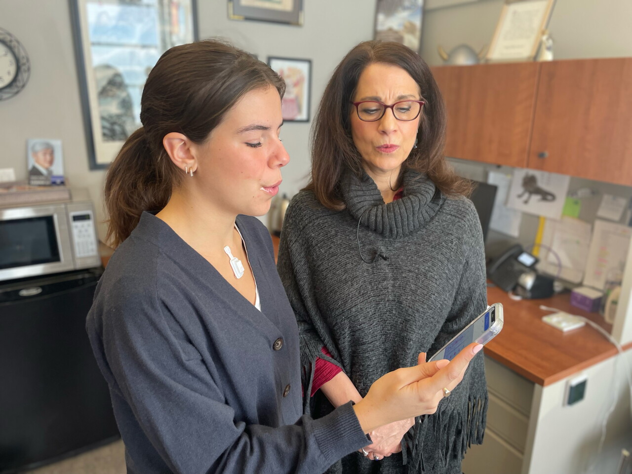 An opera student at Northwestern University tests the device and accompanying app with senior lecturer Teresa Brancaccio.
