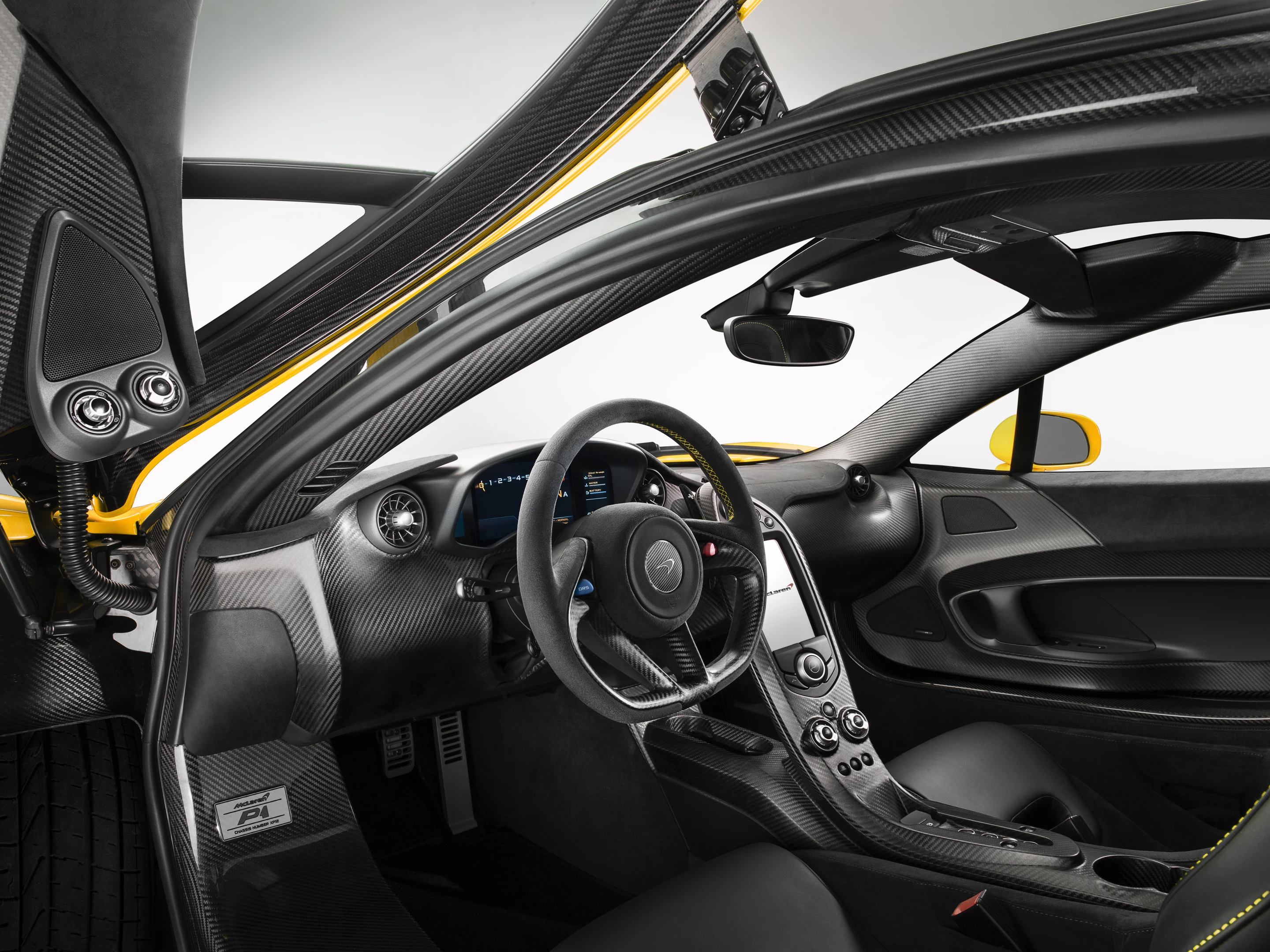 Carbon fiber, acres of carbon fiber cover the P1's interior and exterior bits like a hi-tech moss