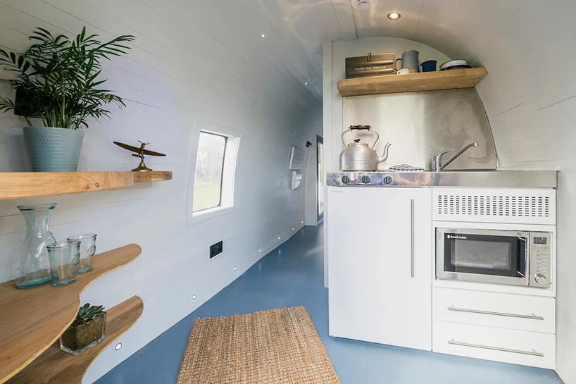 The unique accommodation features a kitchen, bathroom and private cockpit lounge – double doors lead out onto an outdoor patio, where guest can relax and enjoy views of the surrounding landscape