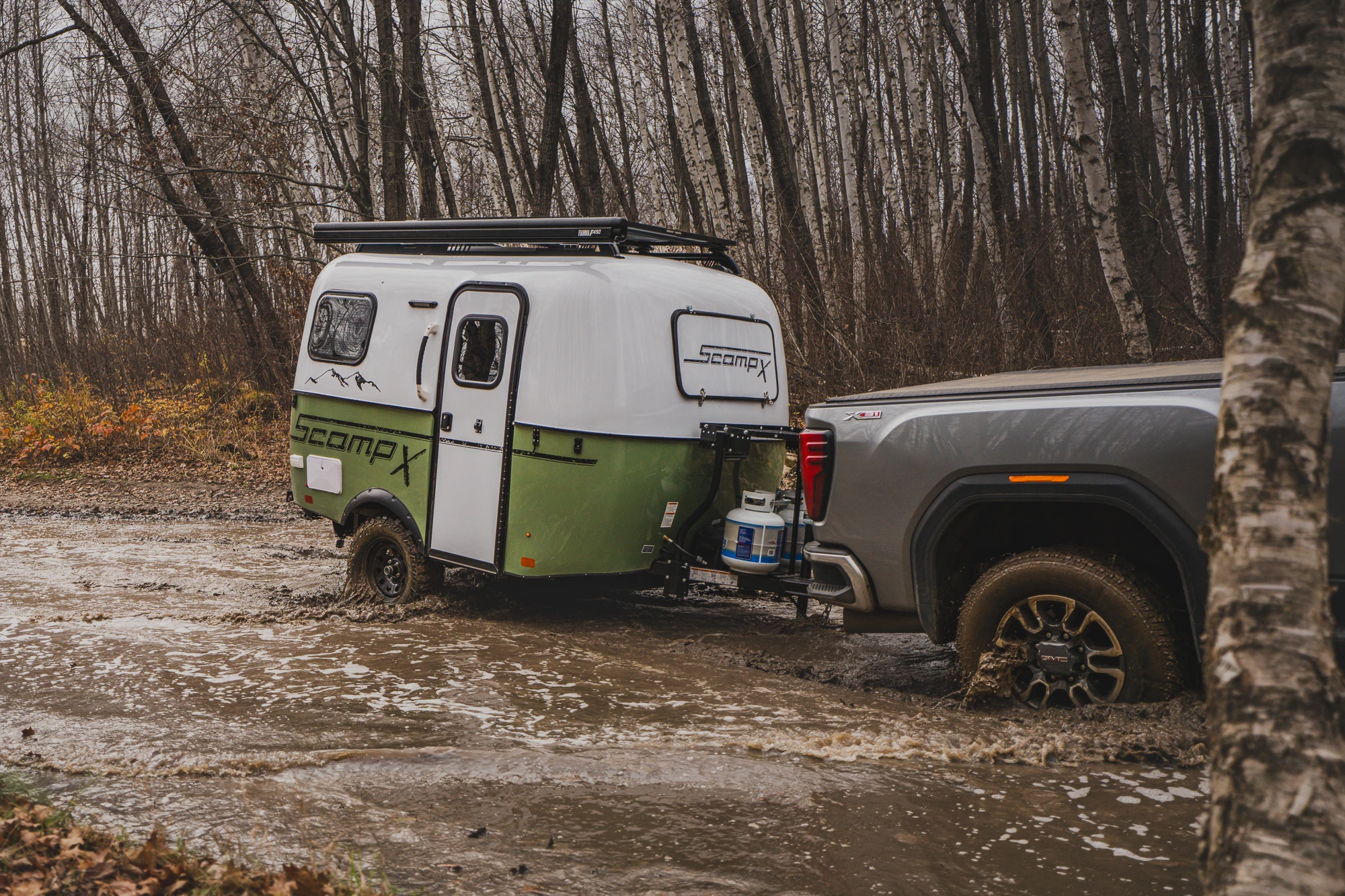 The Scamp X puts its increased ground clearance to work through absolute filth