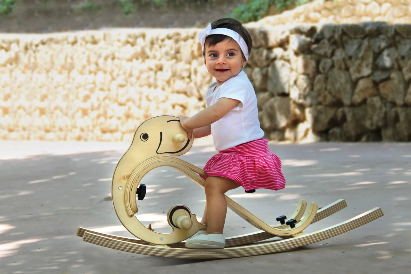 A child enjoys the rocking elephant