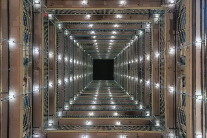 Herlan's photography looks up from the inside of massive apartment blocks in Hong Kong, revealing incredible symmetry