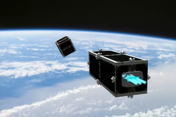 A depiction of CleanSpace One, closing in on an expired picosatellite