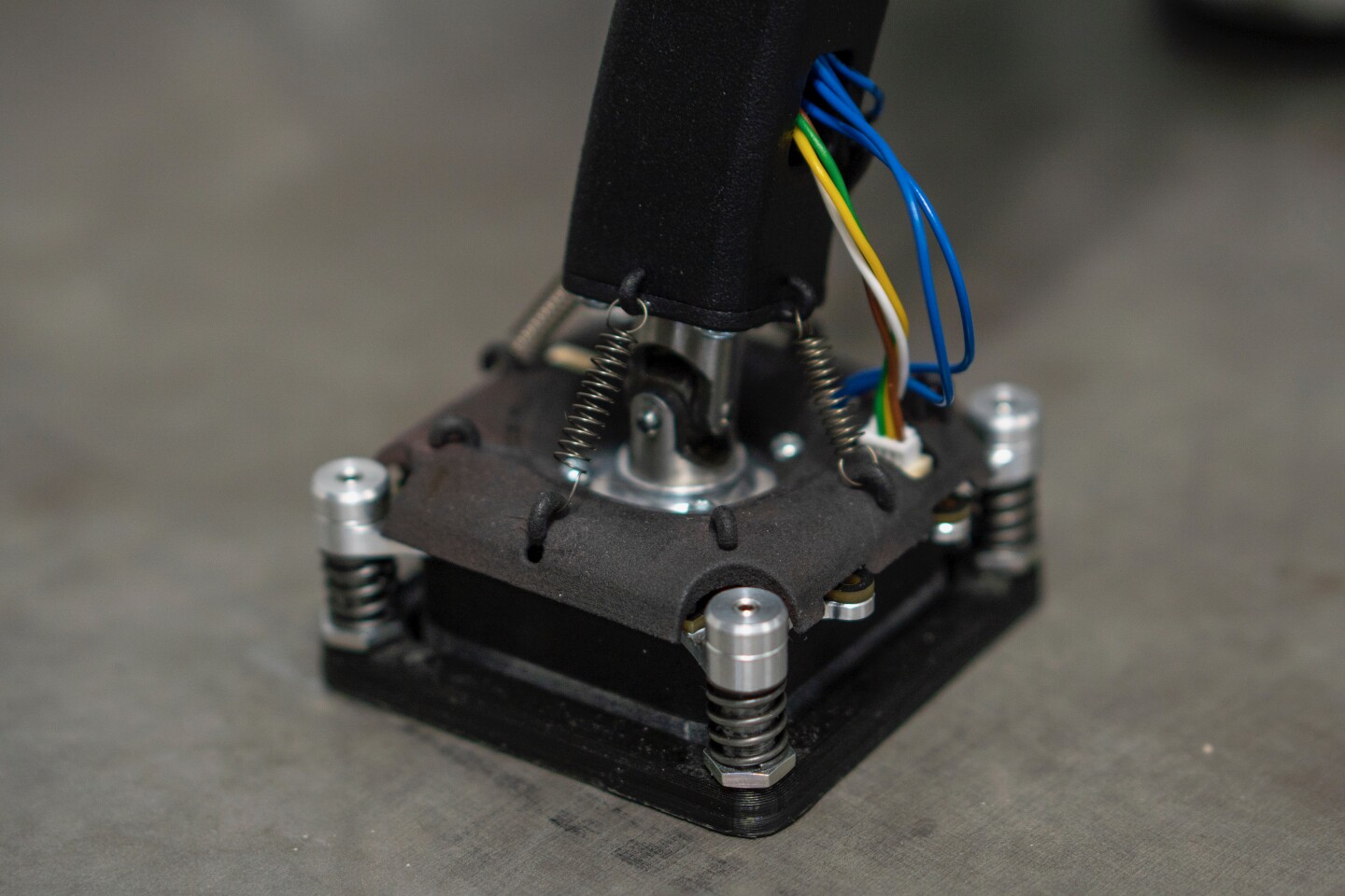 A close look at one of the robot's spring-loaded, rubber-padded, electromagnetic feet