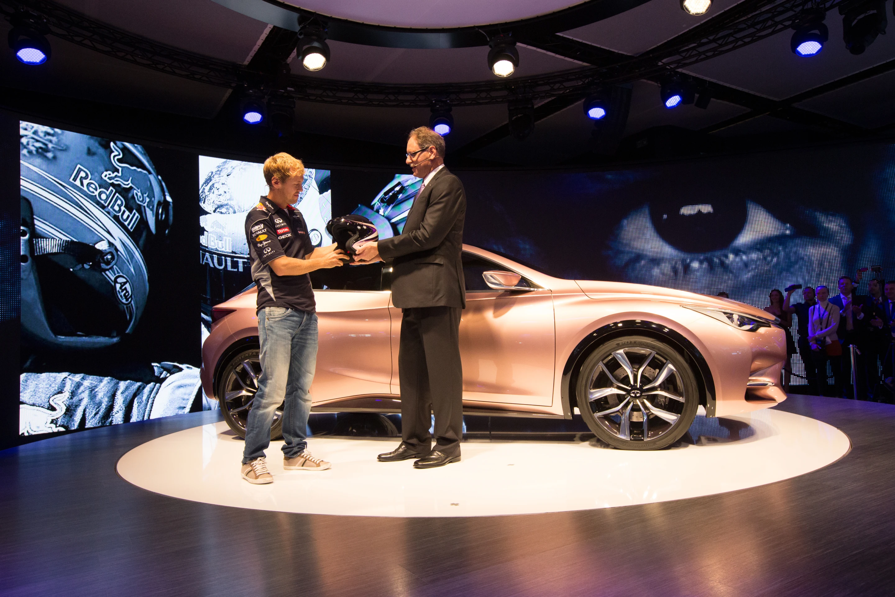 The metallic gold delivery and a promotional drop-in from Formula One champ Sebastien Vettel will doubtless enhance the car's prestige
