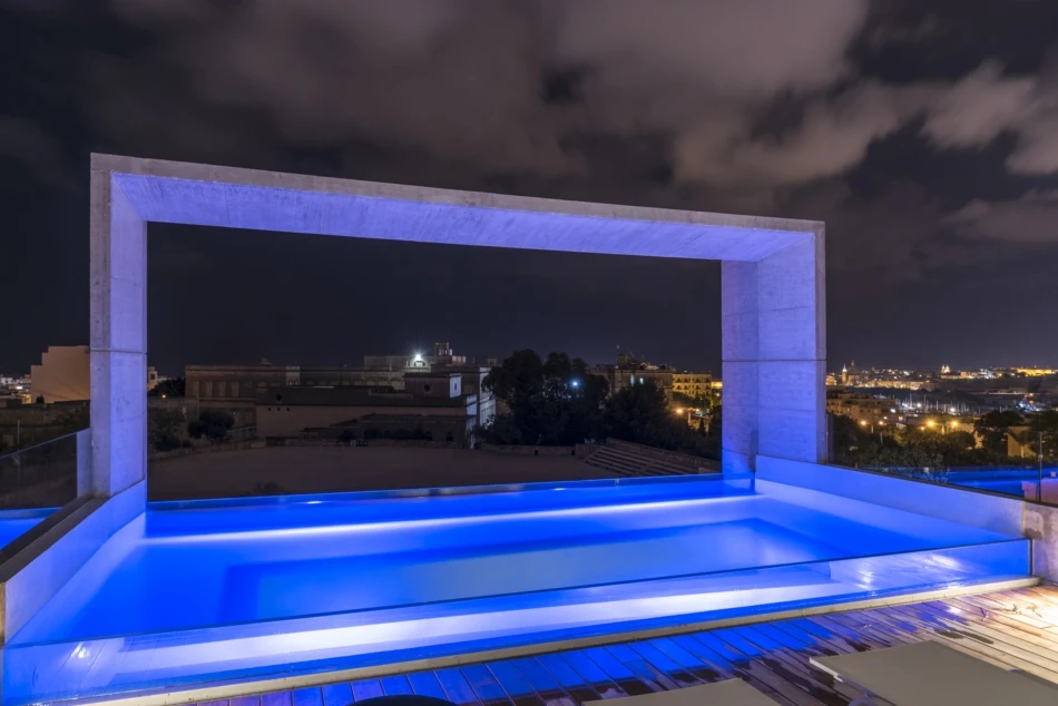 View of Casa B's the rooftop pool at night