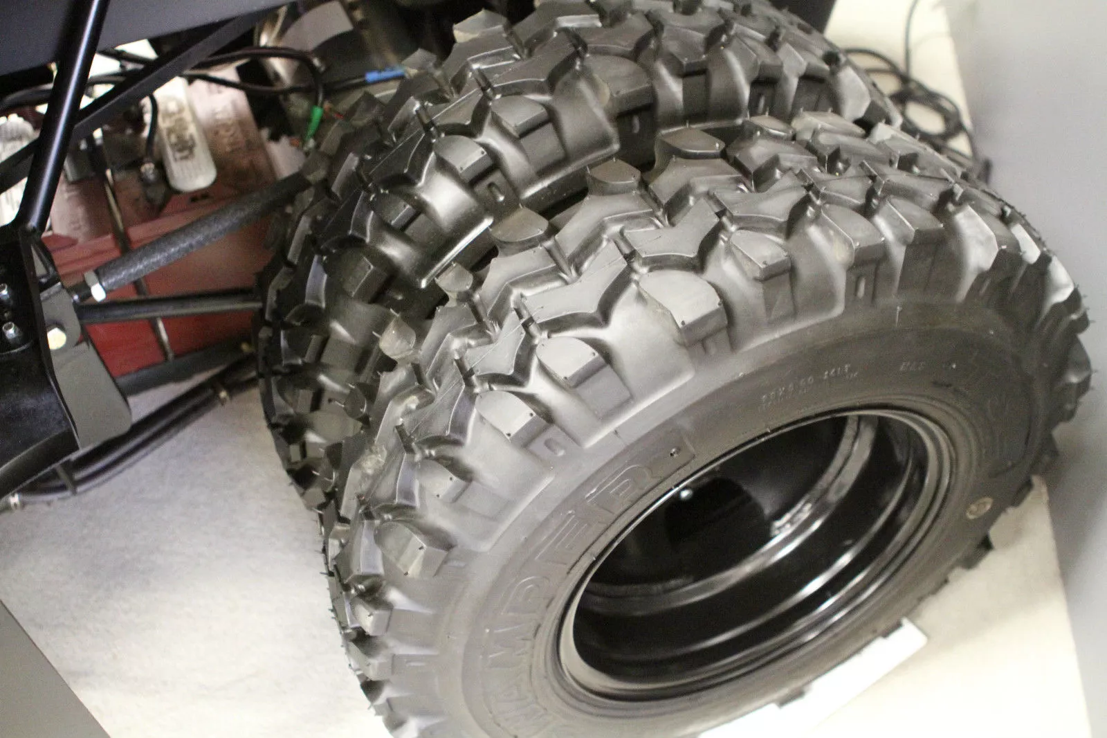 Custom-made dual 28 inch Super Swamper tires shod the back to manage sand traps and water hazards