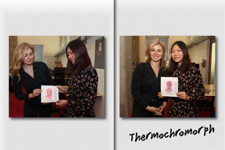 Researchers Paris Myers (left) and Ticha Sethapakdi (right) hold a Thermochromorph image that turns its head as the temperature rises