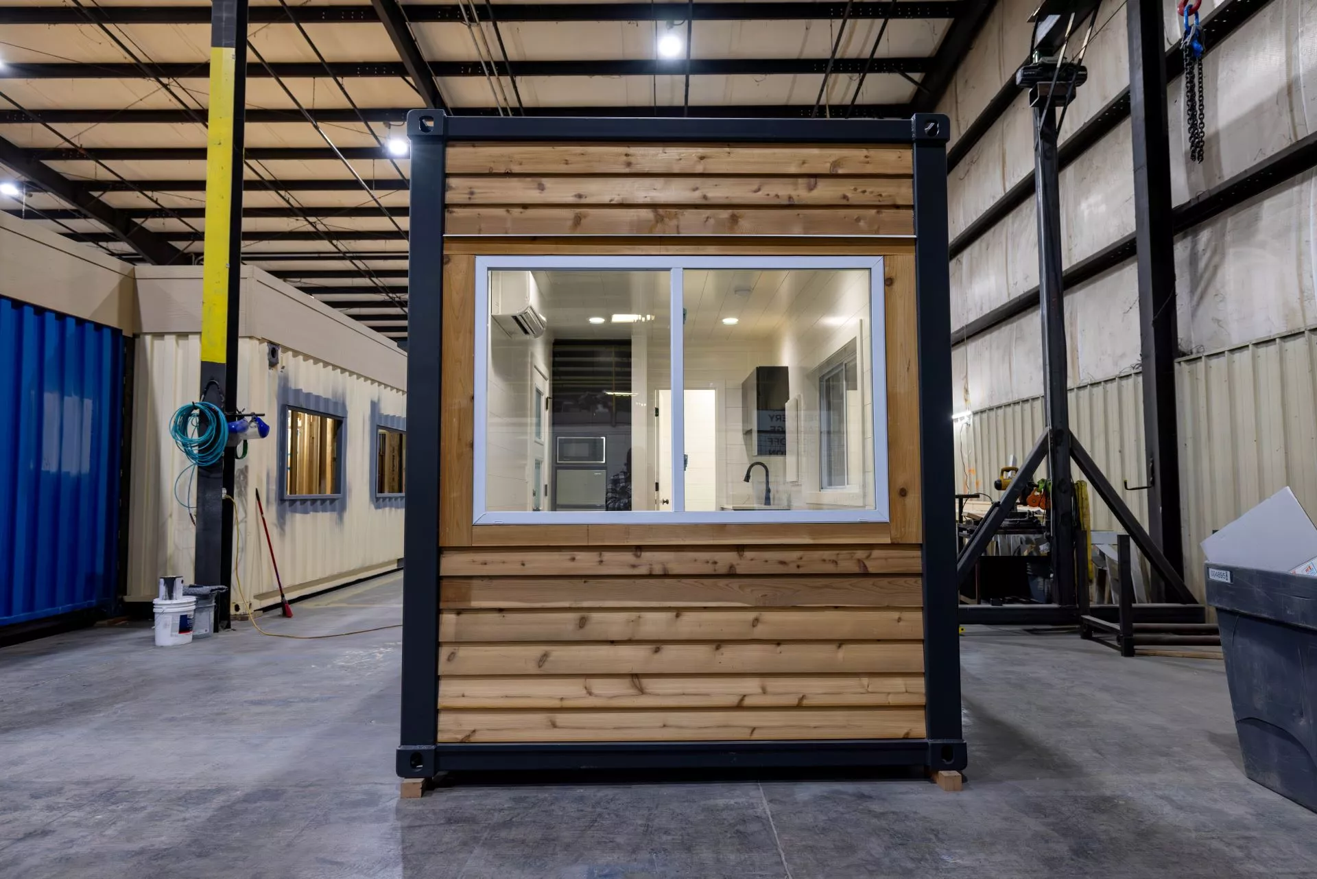 The Nook's exterior has been painted black and it has cedar accenting