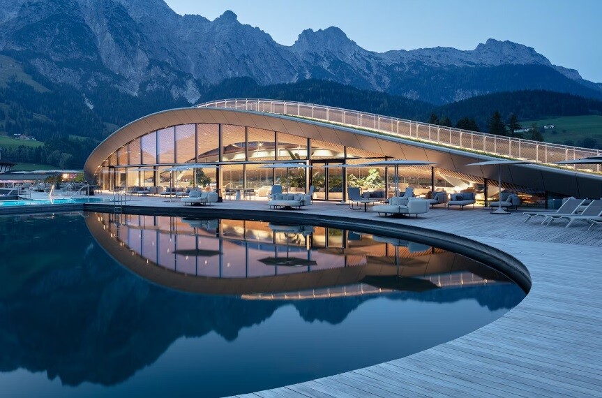 The design of the "ATMOSPHERE" project showcases a striking curved split-roof structure spanning over 100 meters (328 ft)