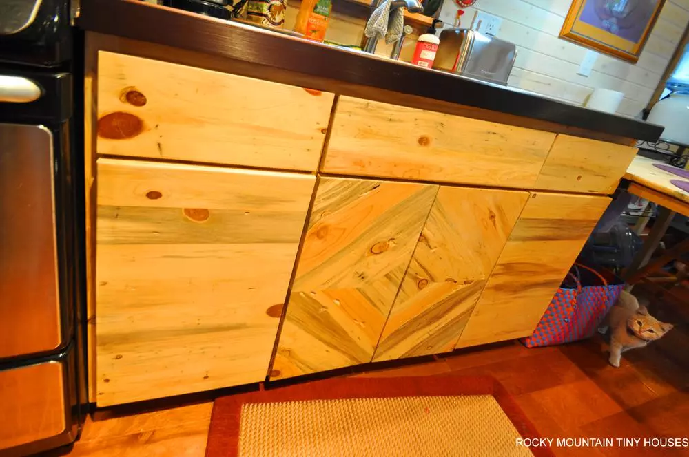 Rocky Mountain Tiny Houses custom made all the cabinets in the Red Mountain 34' Tiny House