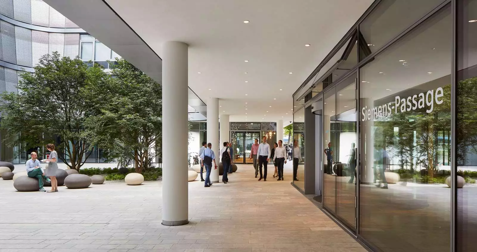 The building is located around four courtyards that are cut out from the main volume