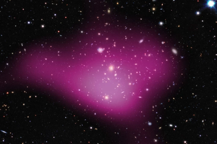 The survey aims to map out the Universe's dark matter, rendered here in pink over the visible light image