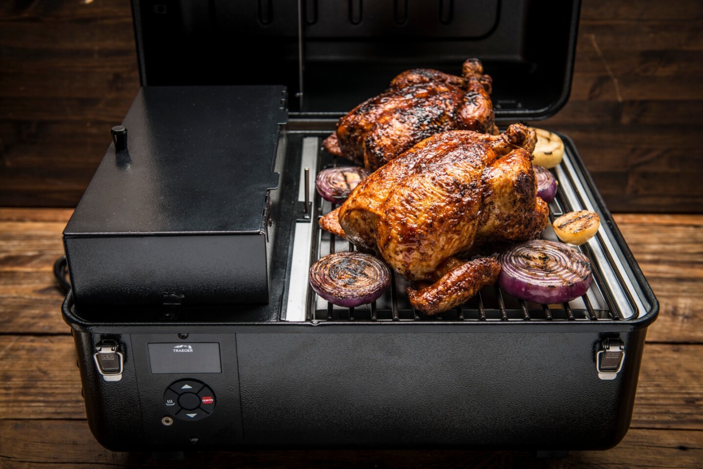 The Traeger Ranger's wood pellet box takes up some of the under-lid space, compacting down cooking room a bit, but it still offers enough space for those two chickens (or the two thick, ~1-lb (450-oz) ribeyes we used it for regularly)
