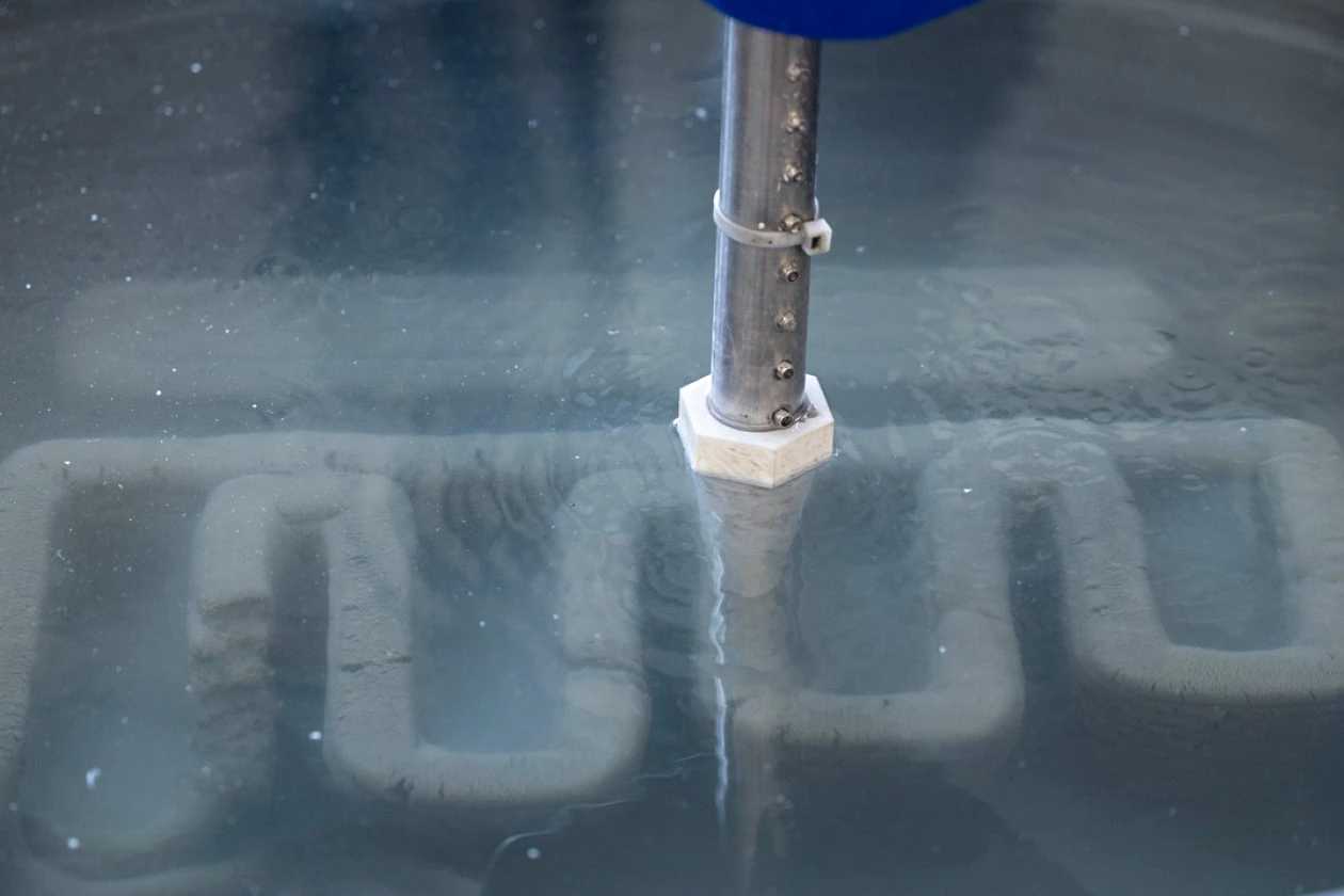 For months, the team has been conducting test prints in a large tub of water, monitoring how the layers are deposited and the strength, shape and texture of each sample