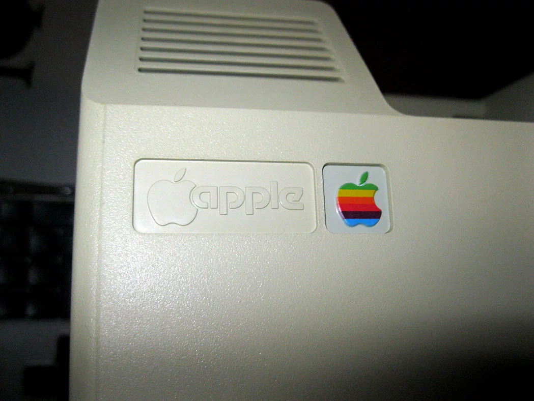 The Macintosh 128K prototype features the classic Apple logo
