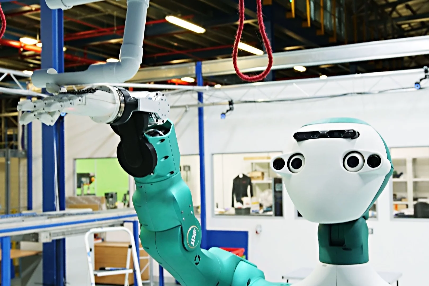 The ARMAR-6 prototype interacting with its environment at Ocado Technology's test lab