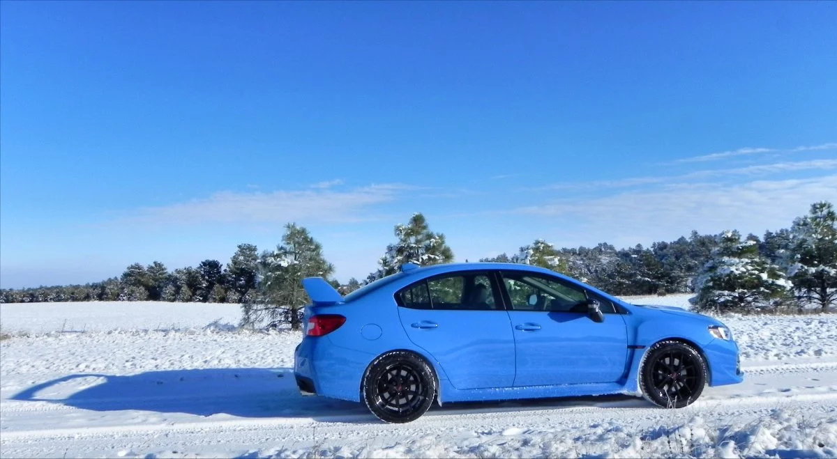 The styling on the STI model is more flamboyant, with a big Tokyo Drift-style aero fin at the rear and plenty of STI badging to make sure its heritage is known