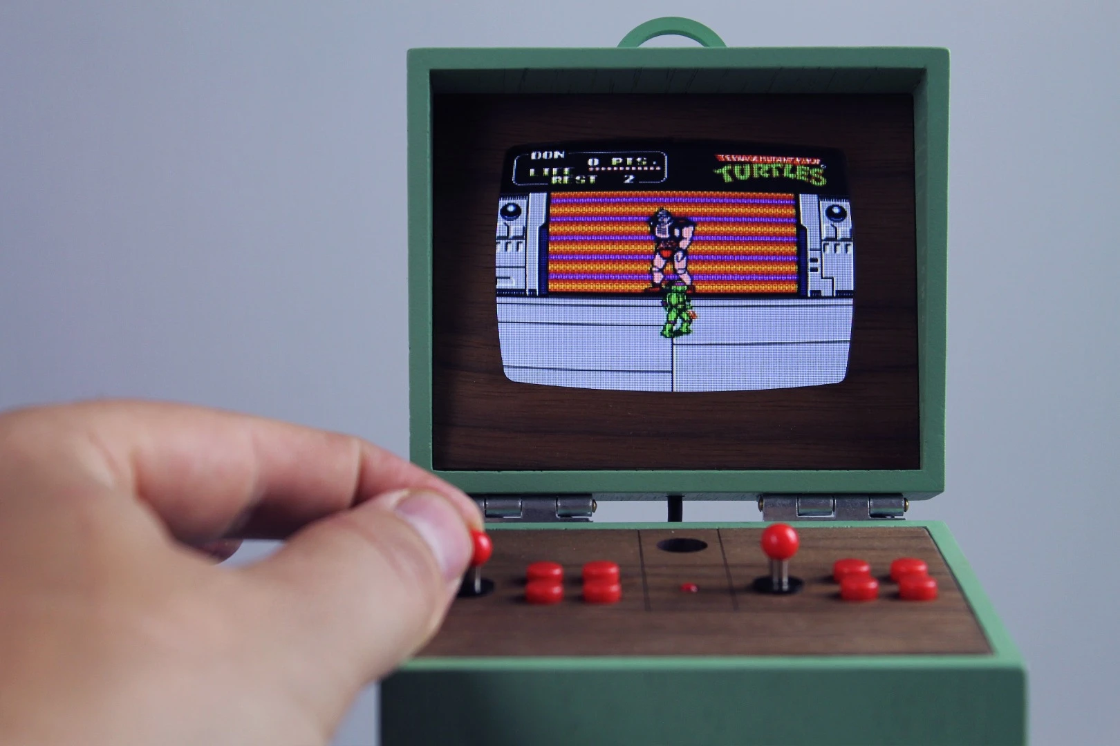 This mini replica of a larger arcade cabinet is fully functional