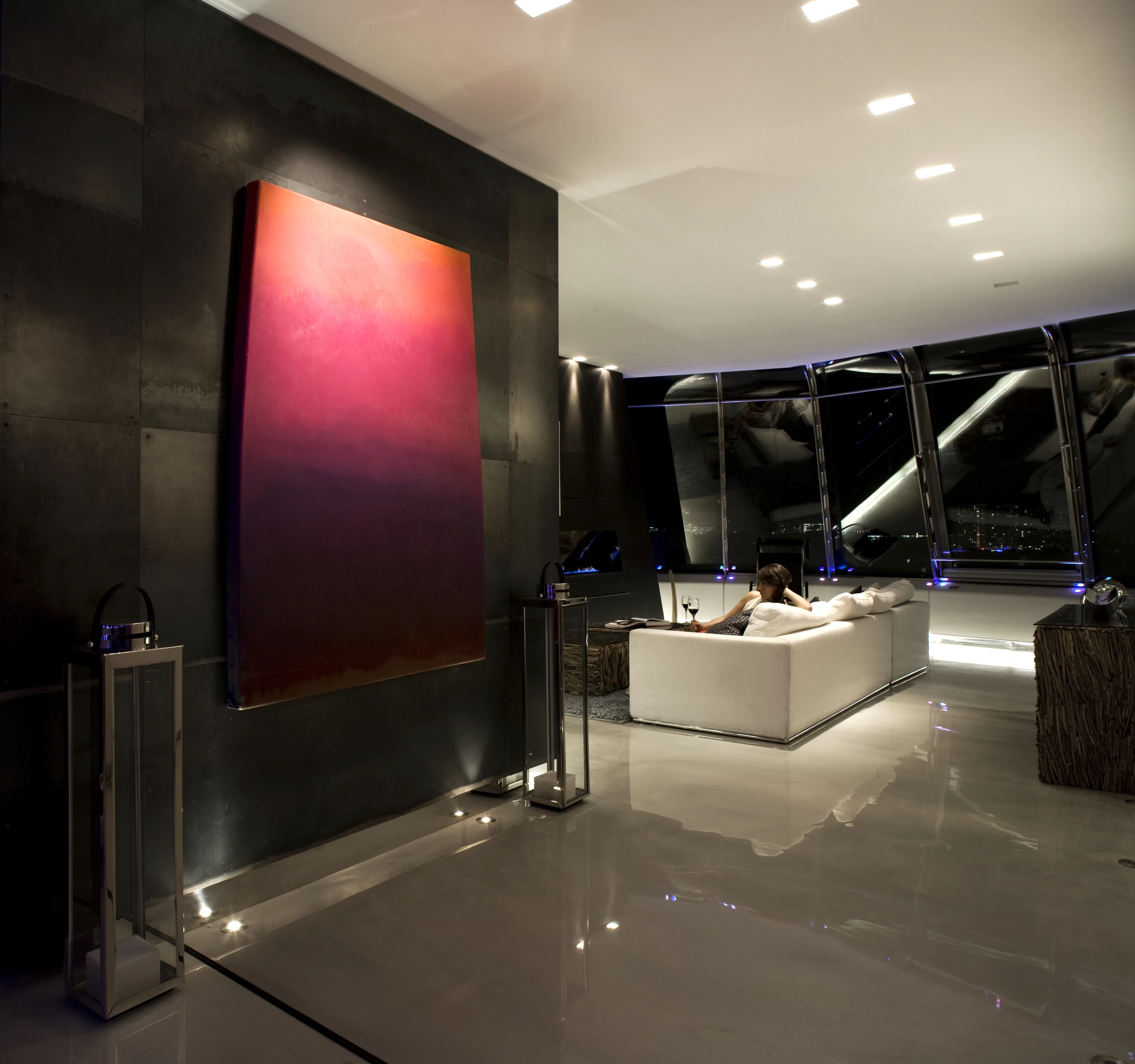 Invisible TV monitors are cleverly hidden behind antiqued mirror panels