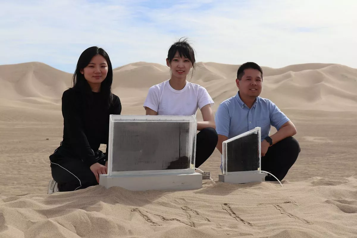 Researchers Shucong Li, “Will” Chang Liu, and Xiao-Yun Yan, with two water harvesters