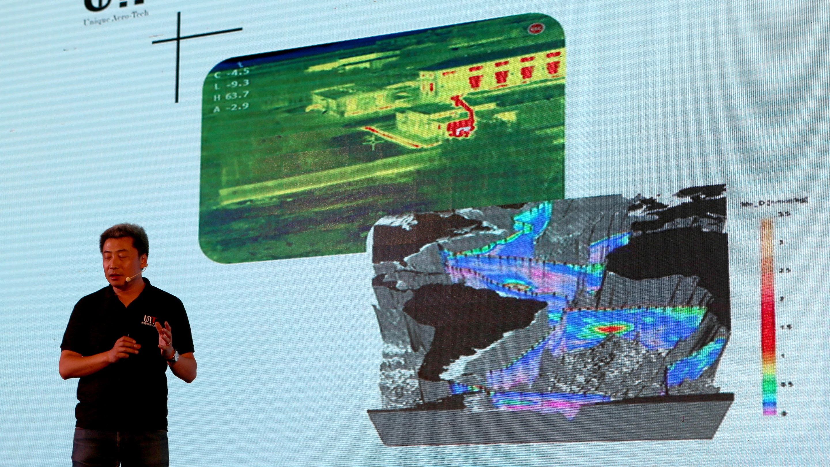 The General Manager of Unique Aero-Tech, Liu Bin, explaining the real-time data acquisition capabilities of his company's new tilt-rotor UAS the TM Forum Smart City In Focus Conference in Yinchuan (China) on September 21, 2017