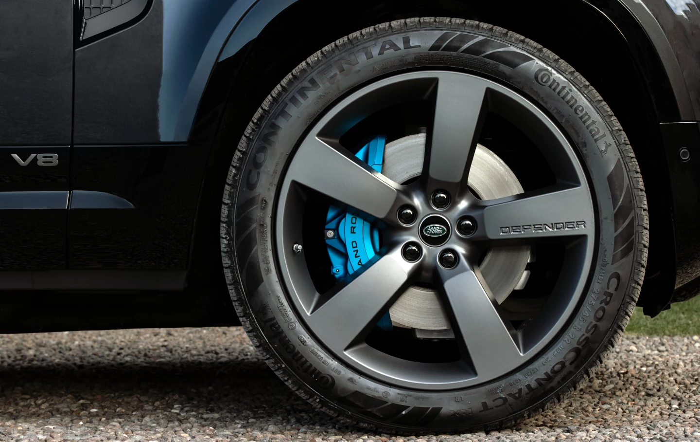 Blue front brake calipers help distinguish Defender V8 from non-V8 Defenders
