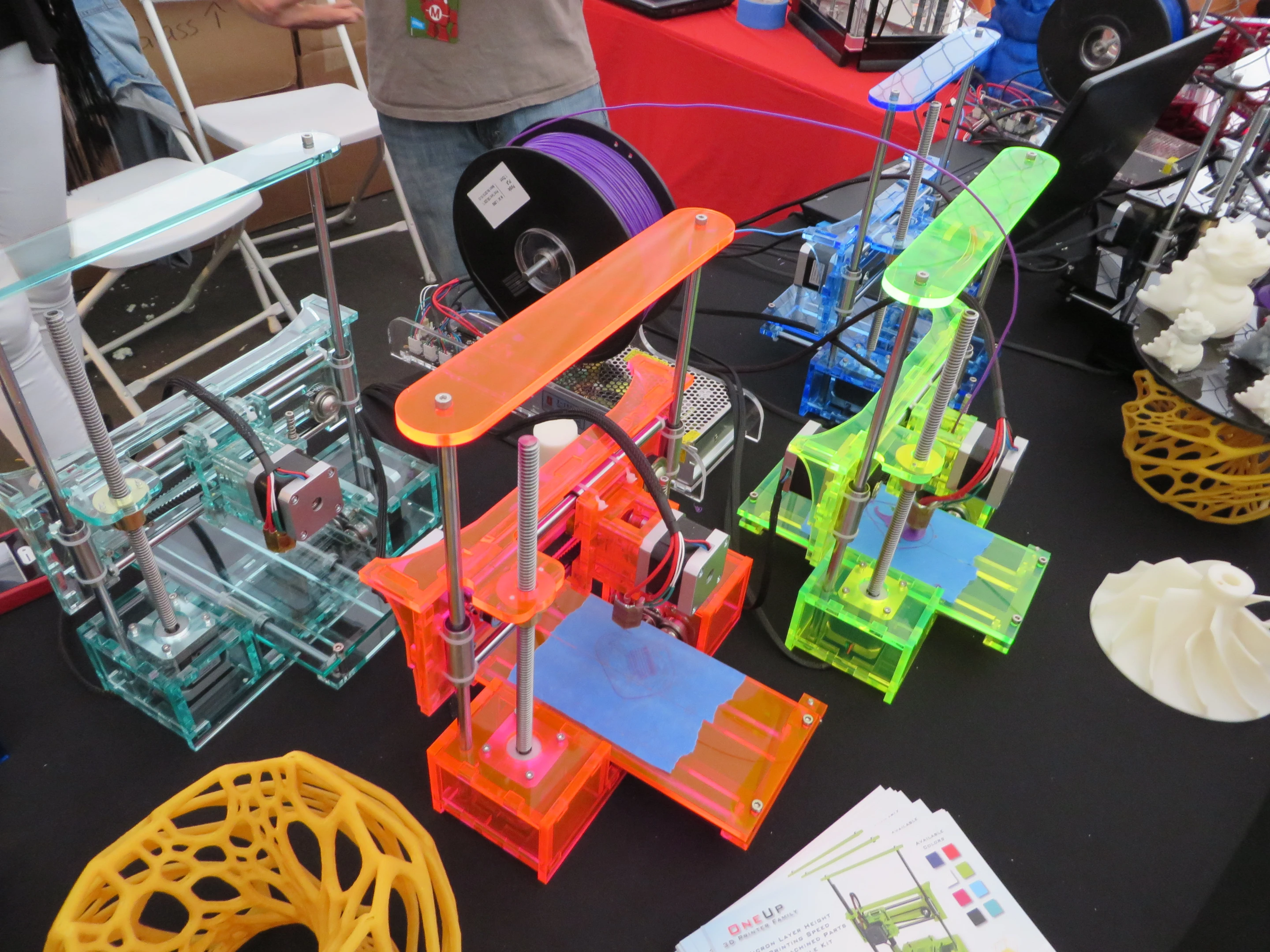Assorted QU-BD printers on display at Maker Faire