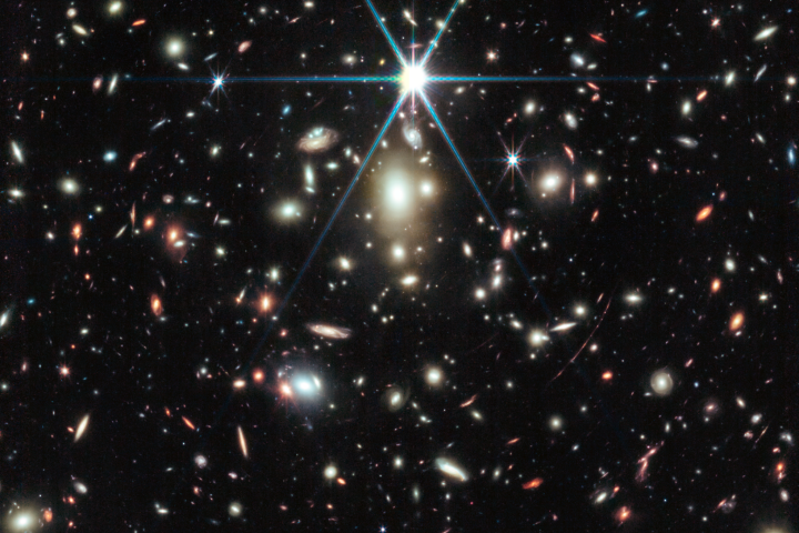 The massive galactic cluster with Earendel in the red arc on the lower right