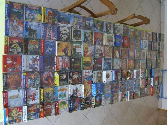 A tabletop full of Mega CD games which made up part of an eBay auction