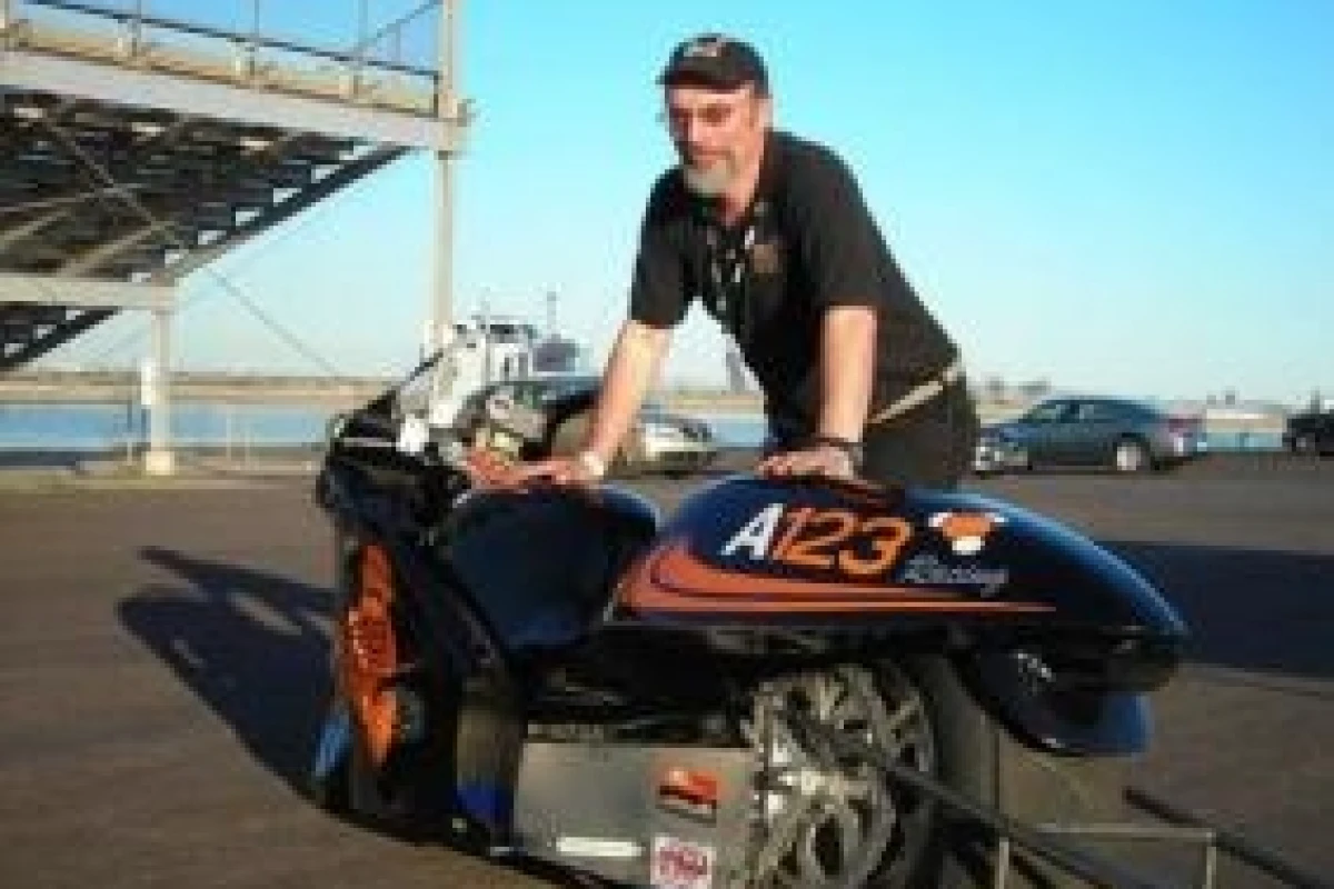 Owner Bill Dube with the Killacycle electric drag bike - before he crashed it into a van.