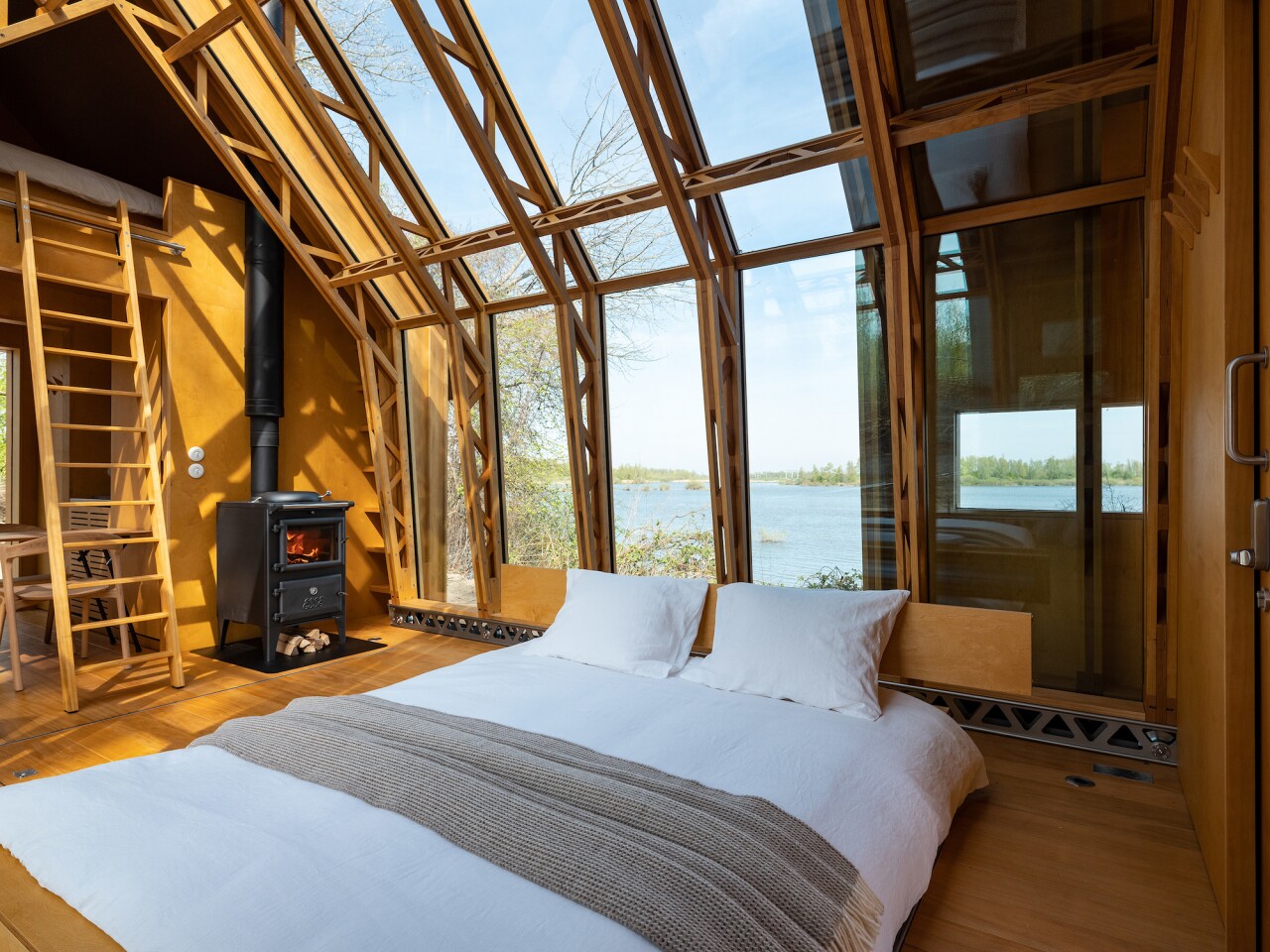 ANNA Stay 2.0 has a small house-style loft bedroom with bed downstairs and access by removable ladder