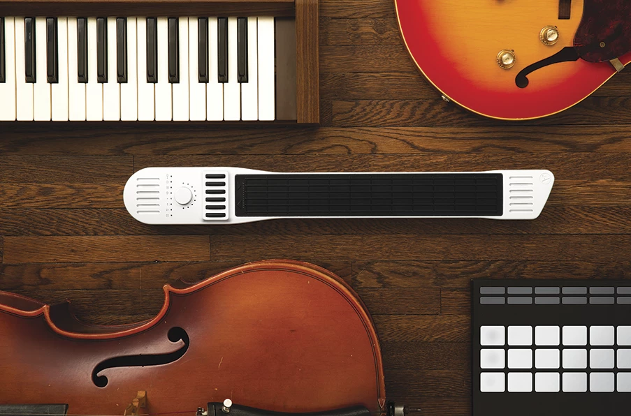 The Instrument 1 connects via USB or Lightning ports to a mobile device running music creation apps
