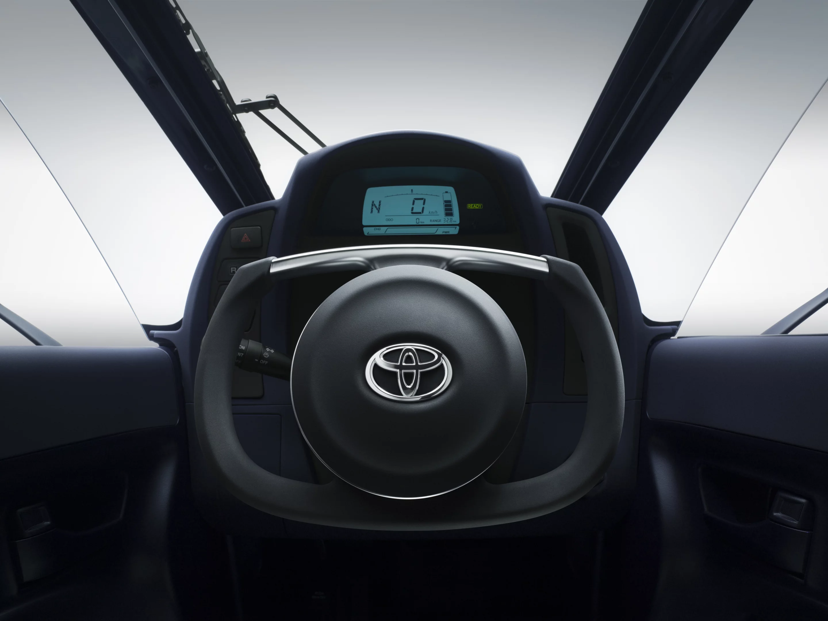 Toyota's i-ROAD is a fully-enclosed, two-seater, three-wheeled, fully-electric, Personal Mobility Vehicle (PMV)