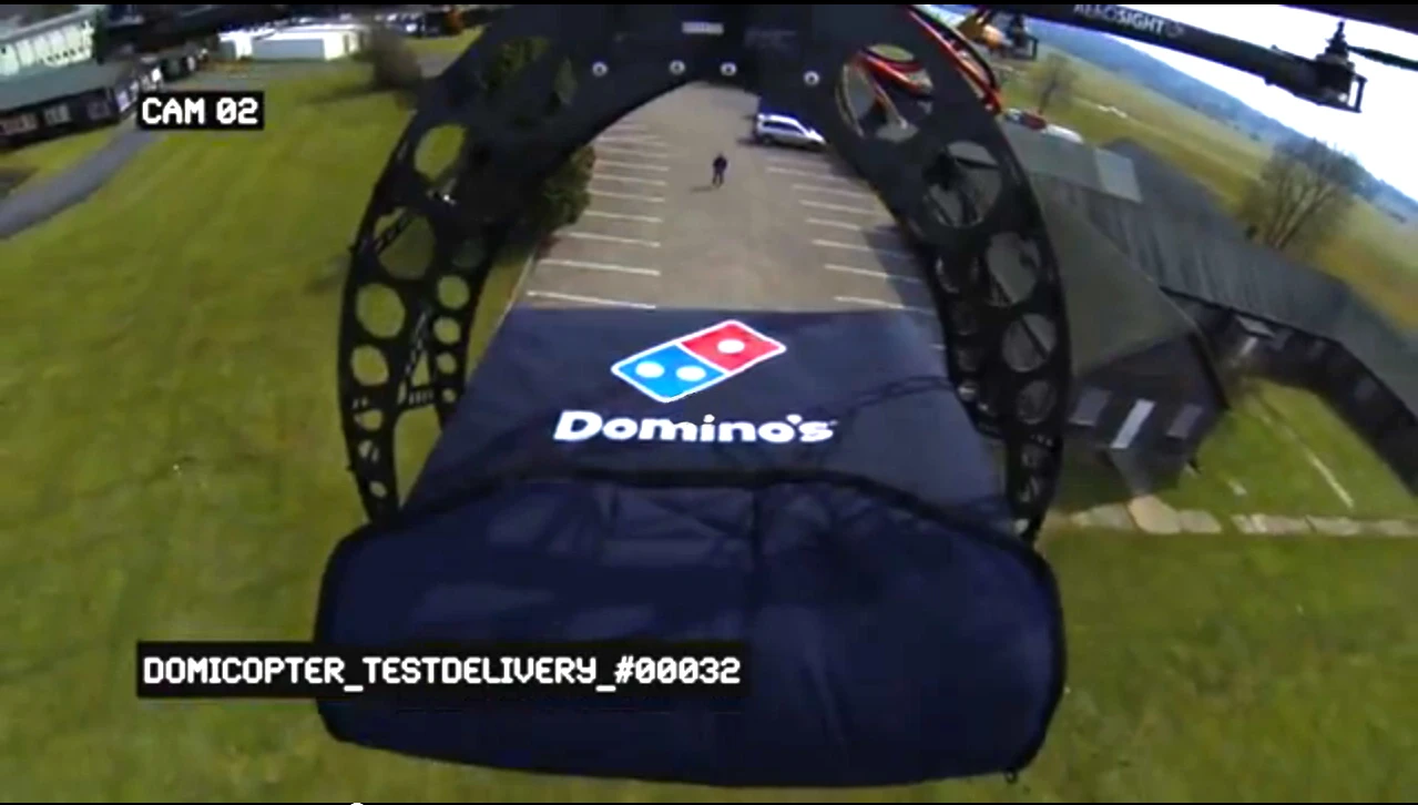 Piloted by AeroSight’s Dean Wynton, the modified octocopter uses oversized claws to firmly grasp the Domino's Heatwave bag