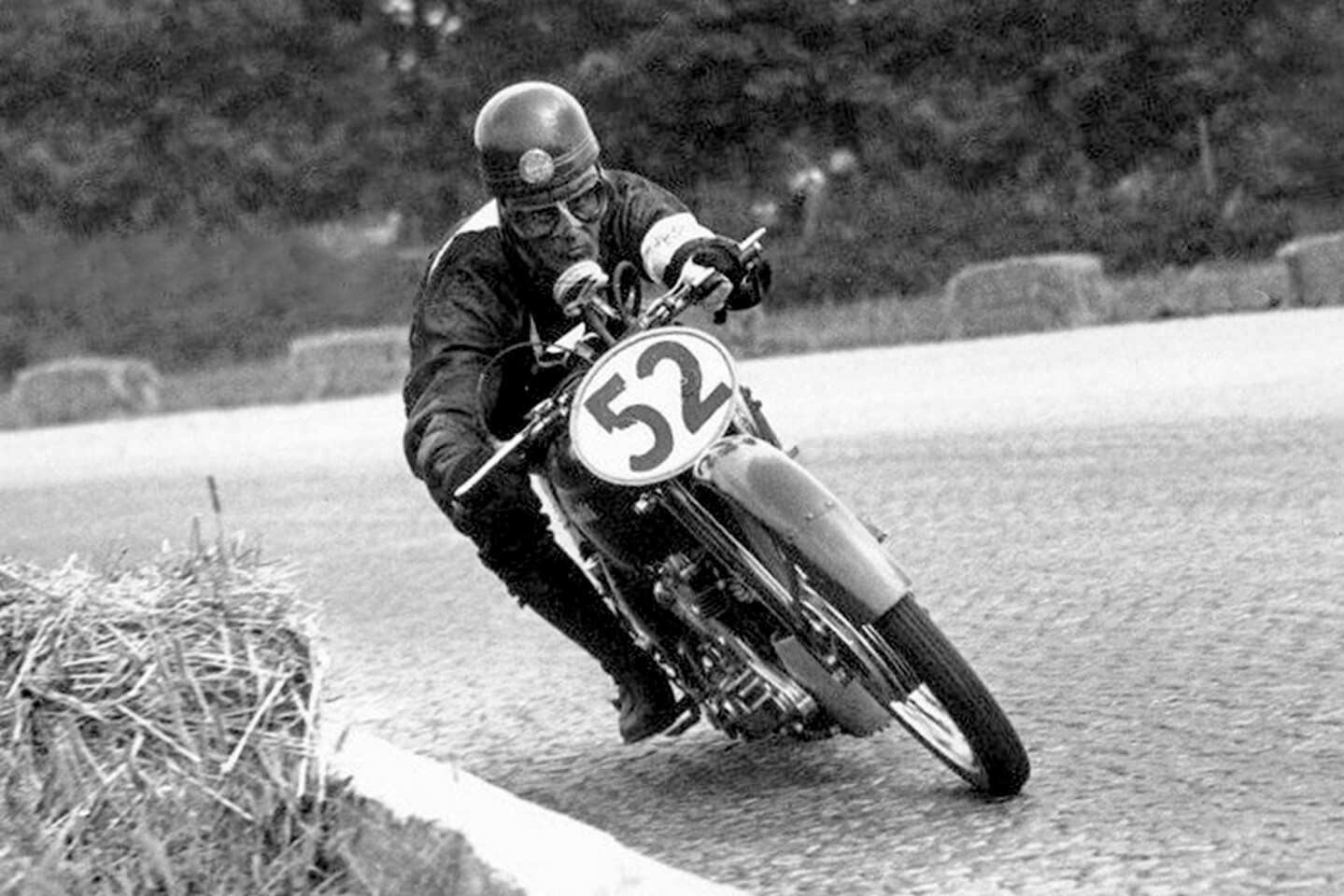 Dario Ambrosini on a 1949 Benelli 250cc Grand Prix racer on his way to winning the 1949 250cc Gran Premio Delle Nazioni (250cc Nations Grand Prix) at Autodromo Nazionale Monza