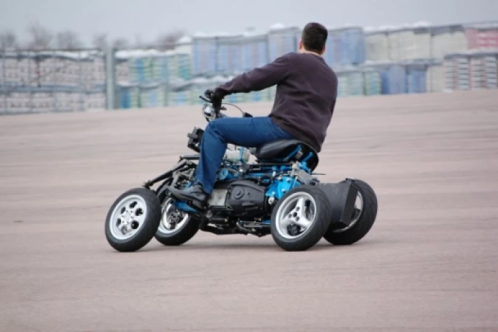 Thanks to its four-wheeled design and ingenious suspension system, which means it can go to full lean, complete with a rider, without falling over even at a standstill