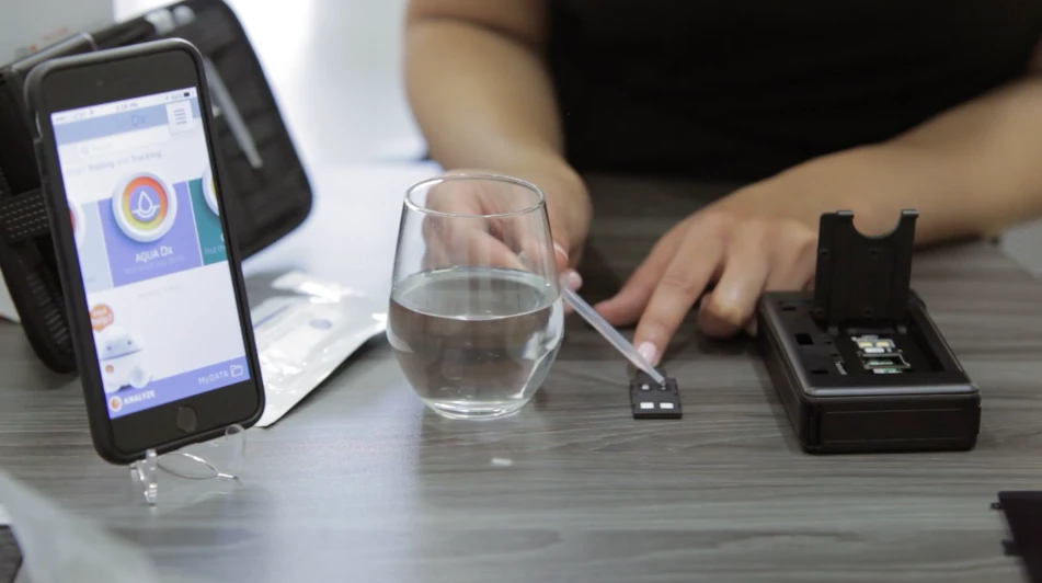 Testing a water sample with AquaDx